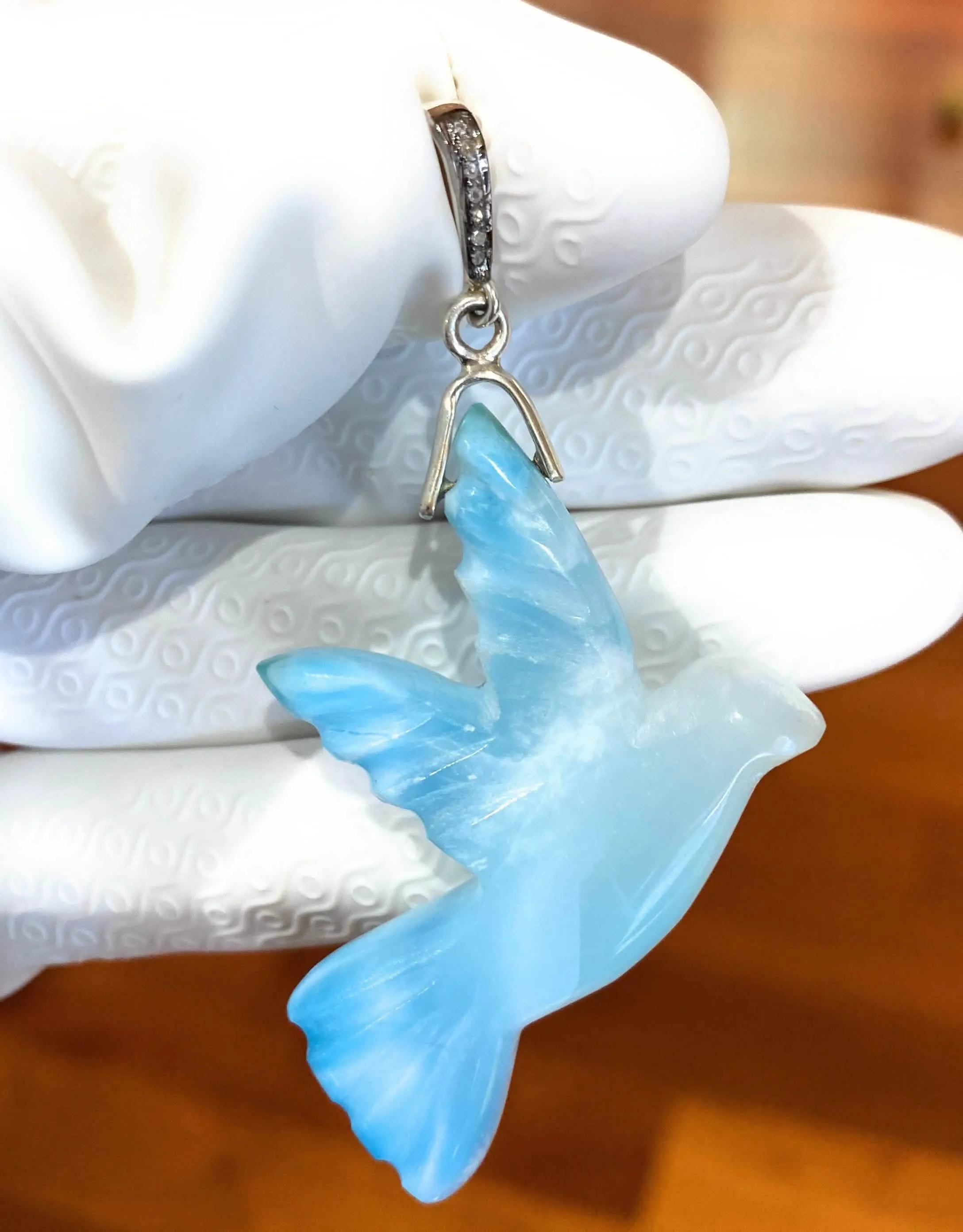 Elegant Hand-Carved Larimar Bird Pendant with Diamond Accents in Sterling Silver