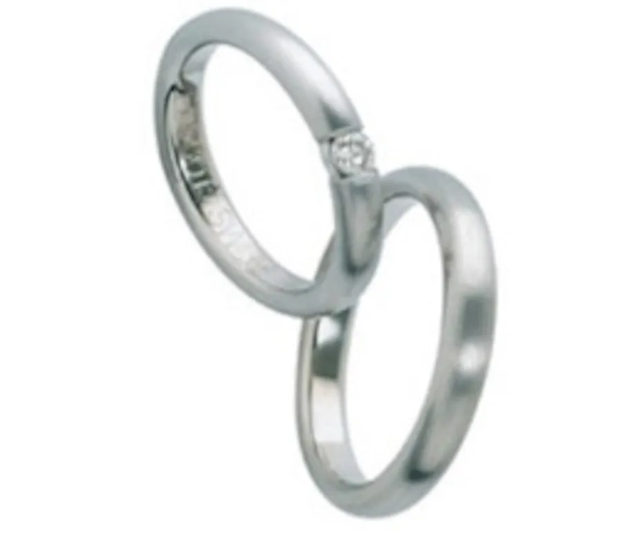 Furrer Jacot Platinum tension set natural diamond ring